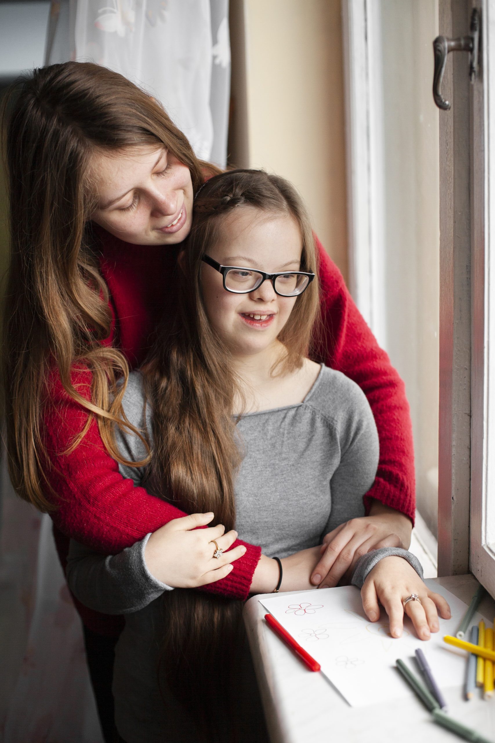 woman-girl-with-down-syndrome-posing-by-window-scaled-e1761845714974